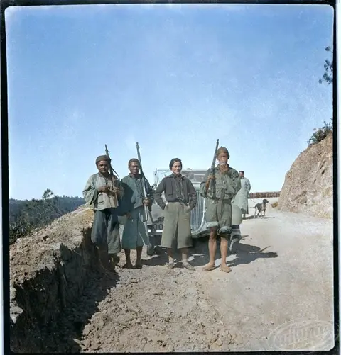 Sofia Yablonska with armed men at Angkor
