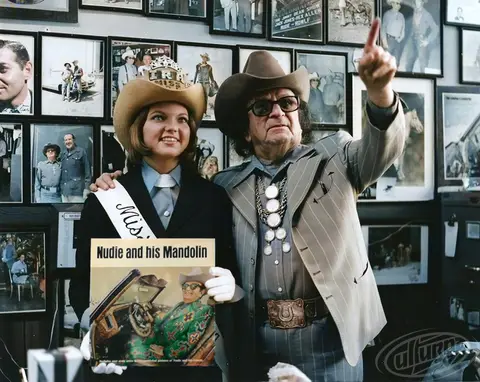 Nudie Cohn in his store with "Nudie and his Mandolin" vinyl