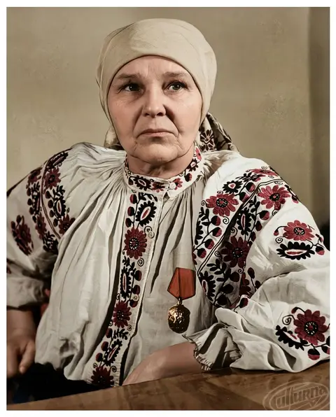 Maria Prymachenko — portrait with a medal in a vyshyvanka